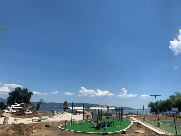 small playground with green rubber surface